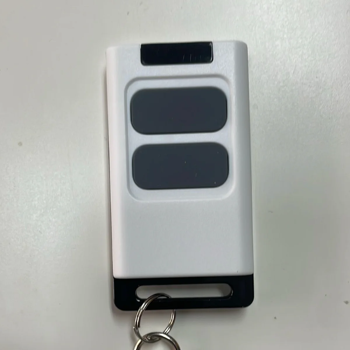 שלט רחוק Comunello Alfa COM לשערים ומחסומים 2 לחצנים